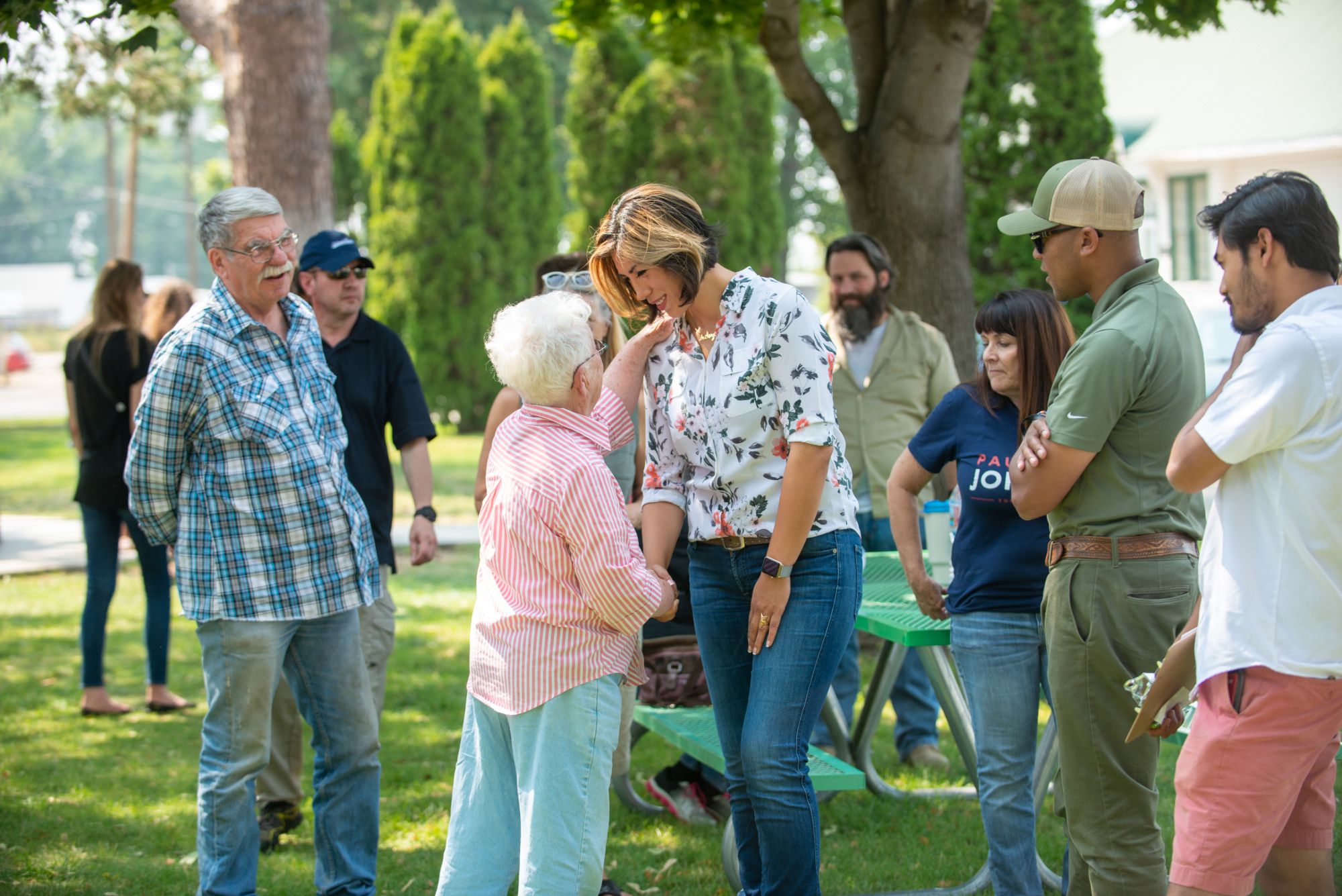 Paulette Jordan meeting community members in a town square